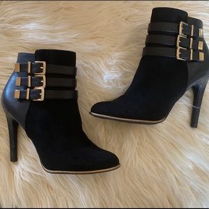 Black heeled boots with gold hardware, never worn!